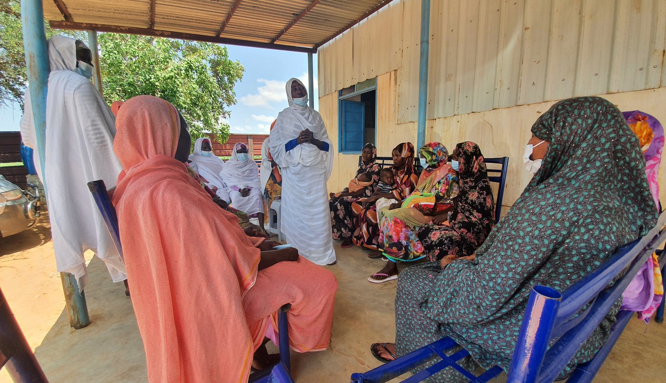 Nutrition workers at a health center in Darfur hold a community education session on maternal nutrition and breastfeeding